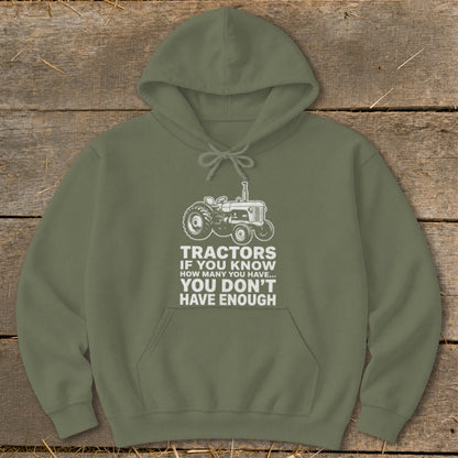 Green hoodie with white tractor graphic and text "Tractors if you know how many you have... you don't have enough".