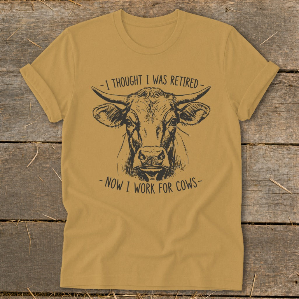 T-shirt with cow drawing and text "I thought I was retired - now I work for cows".