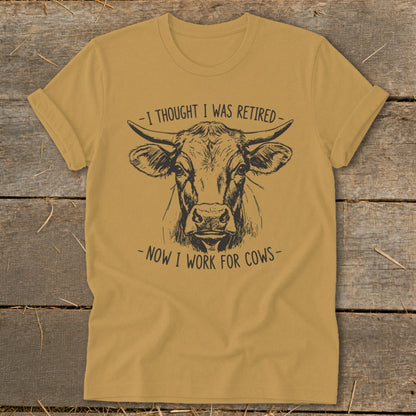 T-shirt with cow drawing and text "I thought I was retired - now I work for cows".