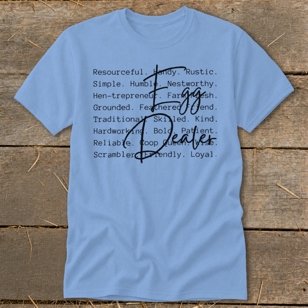 Light blue t-shirt with "Egg Dealer" and descriptive words in black text.
