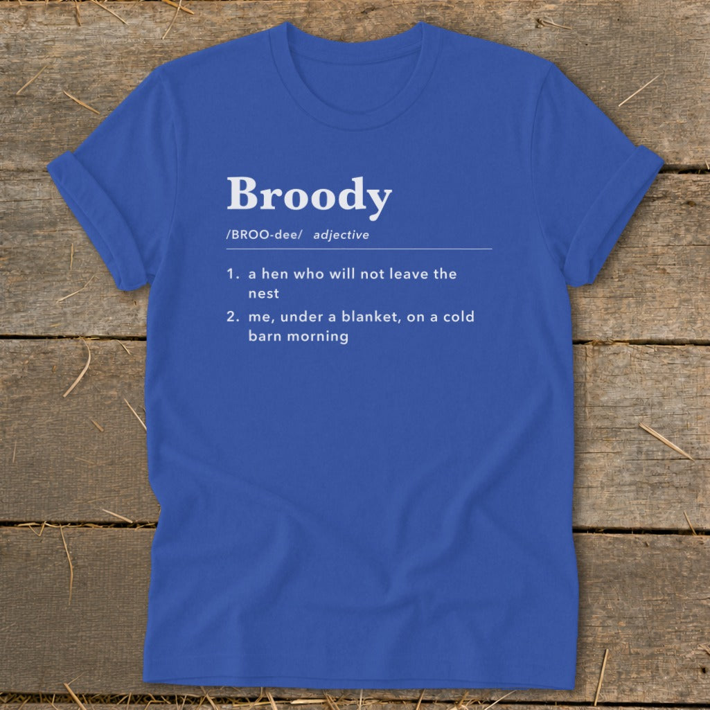 Blue t-shirt with "Broody" defined as a hen in a nest or me under a blanket.