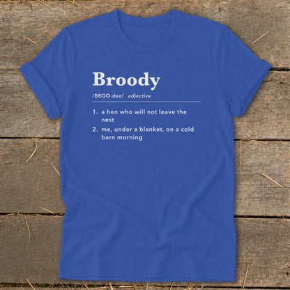 Blue t-shirt with "Broody" defined as a hen in a nest or me under a blanket.