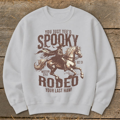 Spooky Rodeo graphic on a white sweatshirt with text: "You Just Yee'd Spooky Rodeo Your Last Haw!"