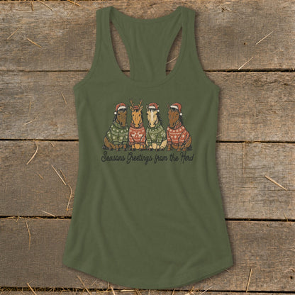 Four horses wearing Santa hats and sweaters, with text "Seasons Greetings from the Herd".