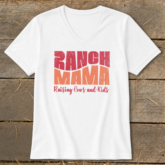 White v-neck t-shirt with "Ranch Mama Raising Cows and Kids" graphic.