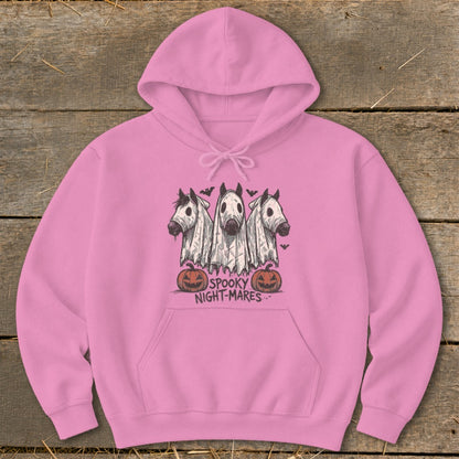 Pink hoodie with "Spooky Night-mares" graphic featuring three horses in ghost costumes and pumpkins.