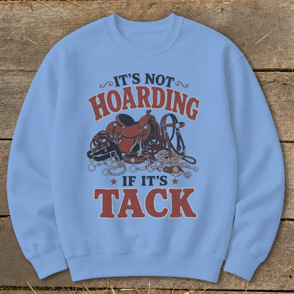 Light blue sweatshirt with "It's not hoarding if it's tack" text and horse tack graphic.