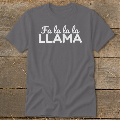 Gray t-shirt with white text "Fa la la la LLAMA" on a wooden background.