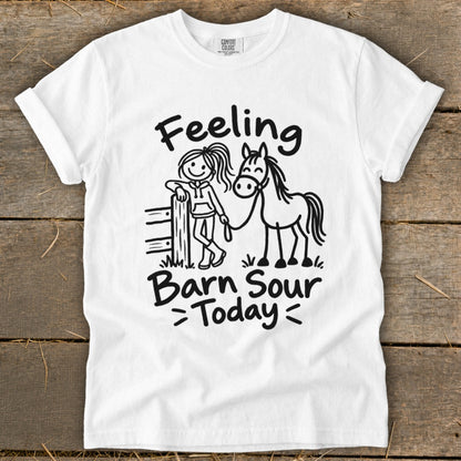 White t-shirt with a line drawing of a girl and a horse, text reads "Feeling Barn Sour >Today<".