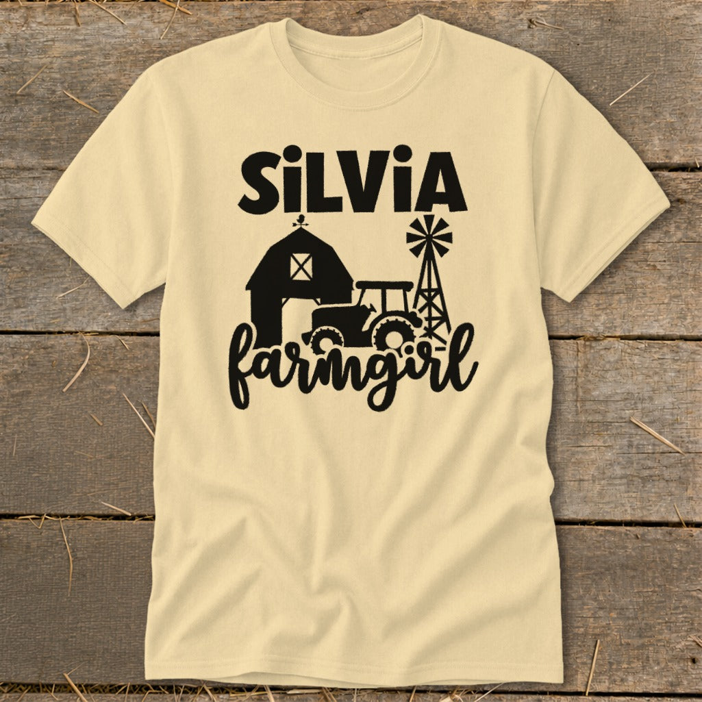 Yellow t-shirt with "Silvia farmgirl" text and farm scene silhouette.