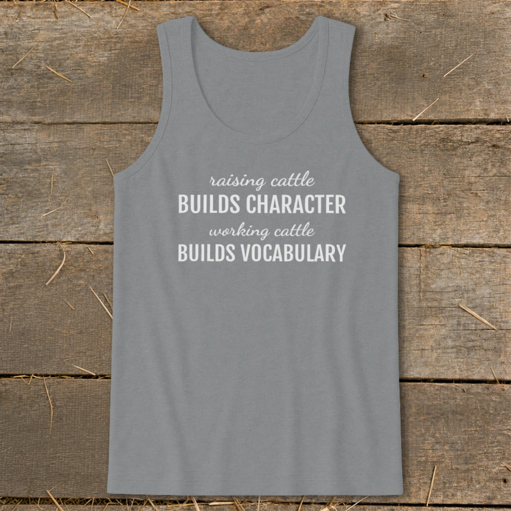 Gray tank top with white text: "raising cattle BUILDS CHARACTER working cattle BUILDS VOCABULARY".