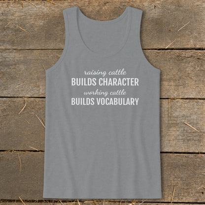 Gray tank top with white text: "raising cattle BUILDS CHARACTER working cattle BUILDS VOCABULARY".
