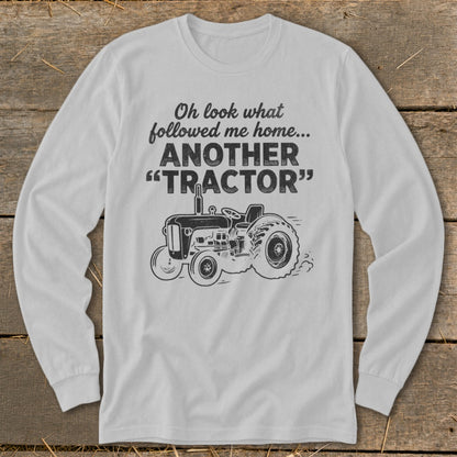 Long sleeve shirt with "Oh look what followed me home... ANOTHER TRACTOR" text and tractor graphic.