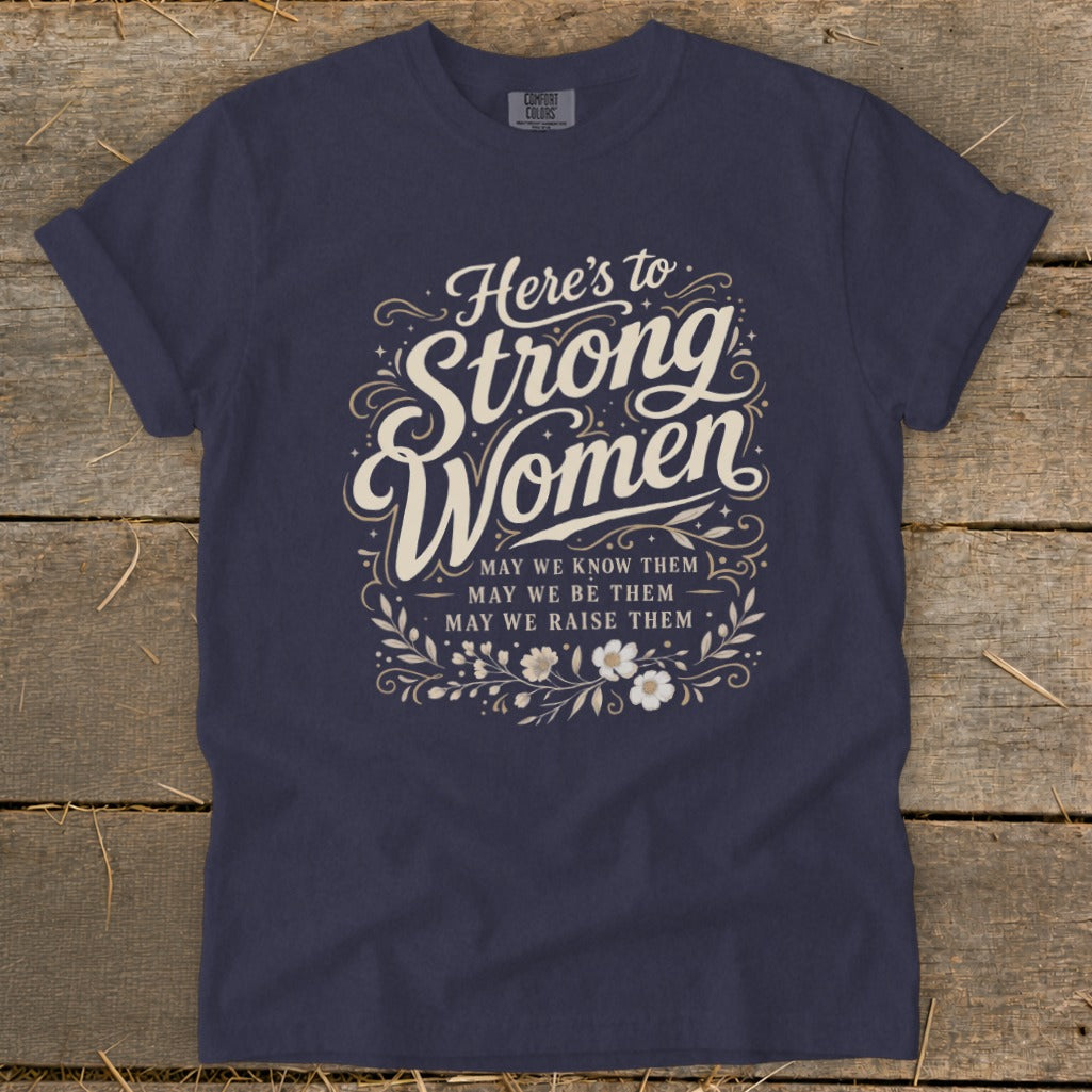 Navy t-shirt with "Here's to Strong Women" text and floral design.