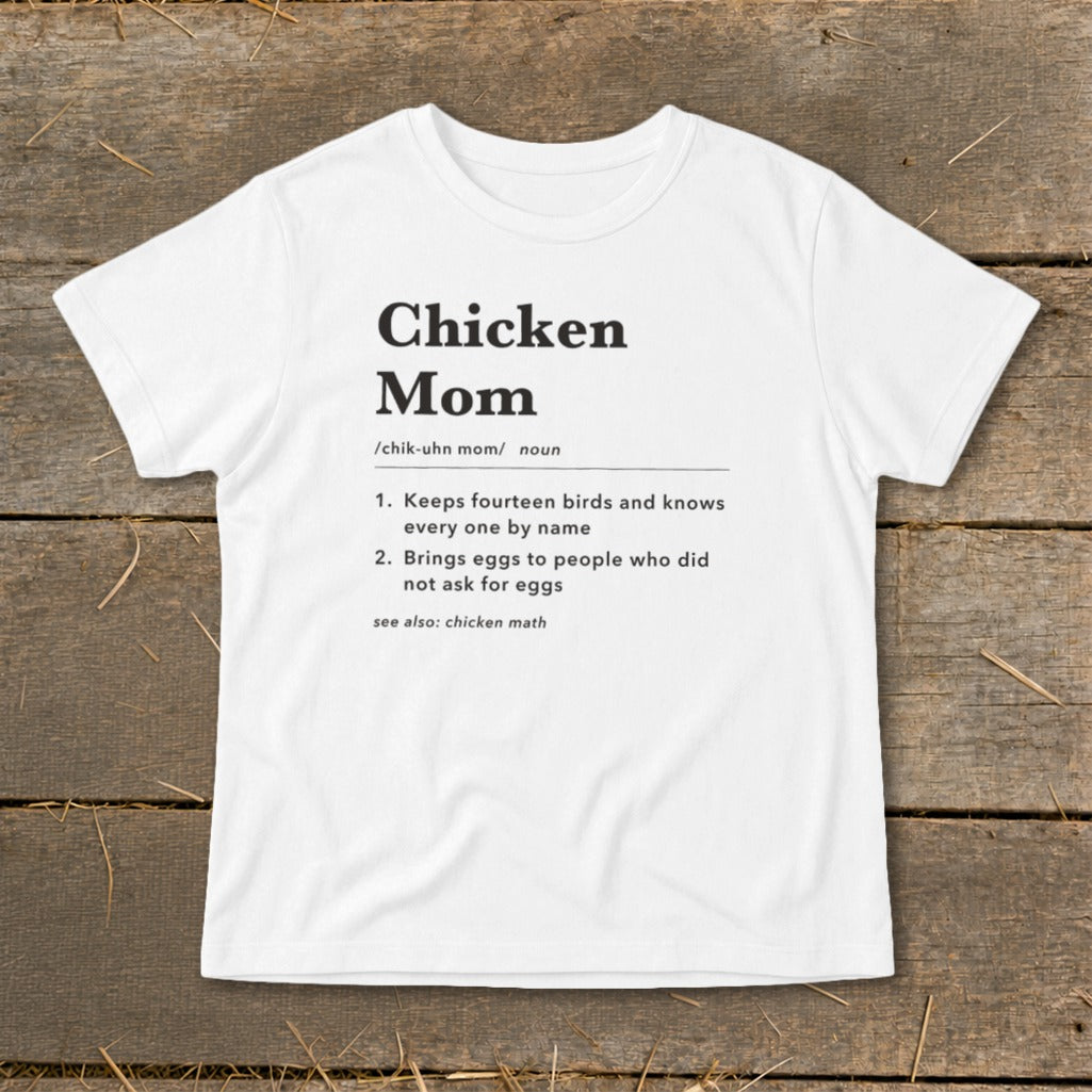 White t-shirt with black text defining "Chicken Mom" and its characteristics.