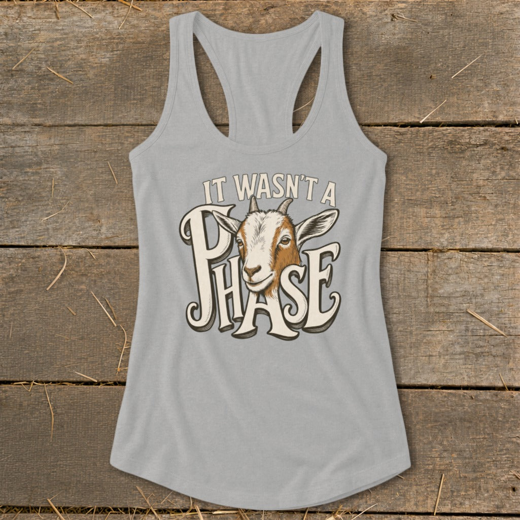 Gray tank top with a graphic of a goat's head and text "IT WASN'T A PHASE".