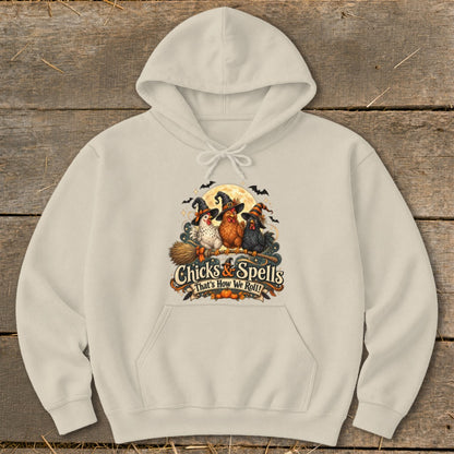 Cream hoodie with "Chicks & Spells That's How We Roll!" Halloween graphic.