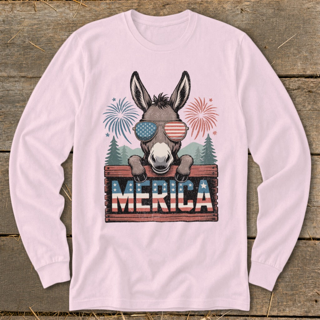 Donkey wearing American flag sunglasses holds "MERICA" sign with fireworks.