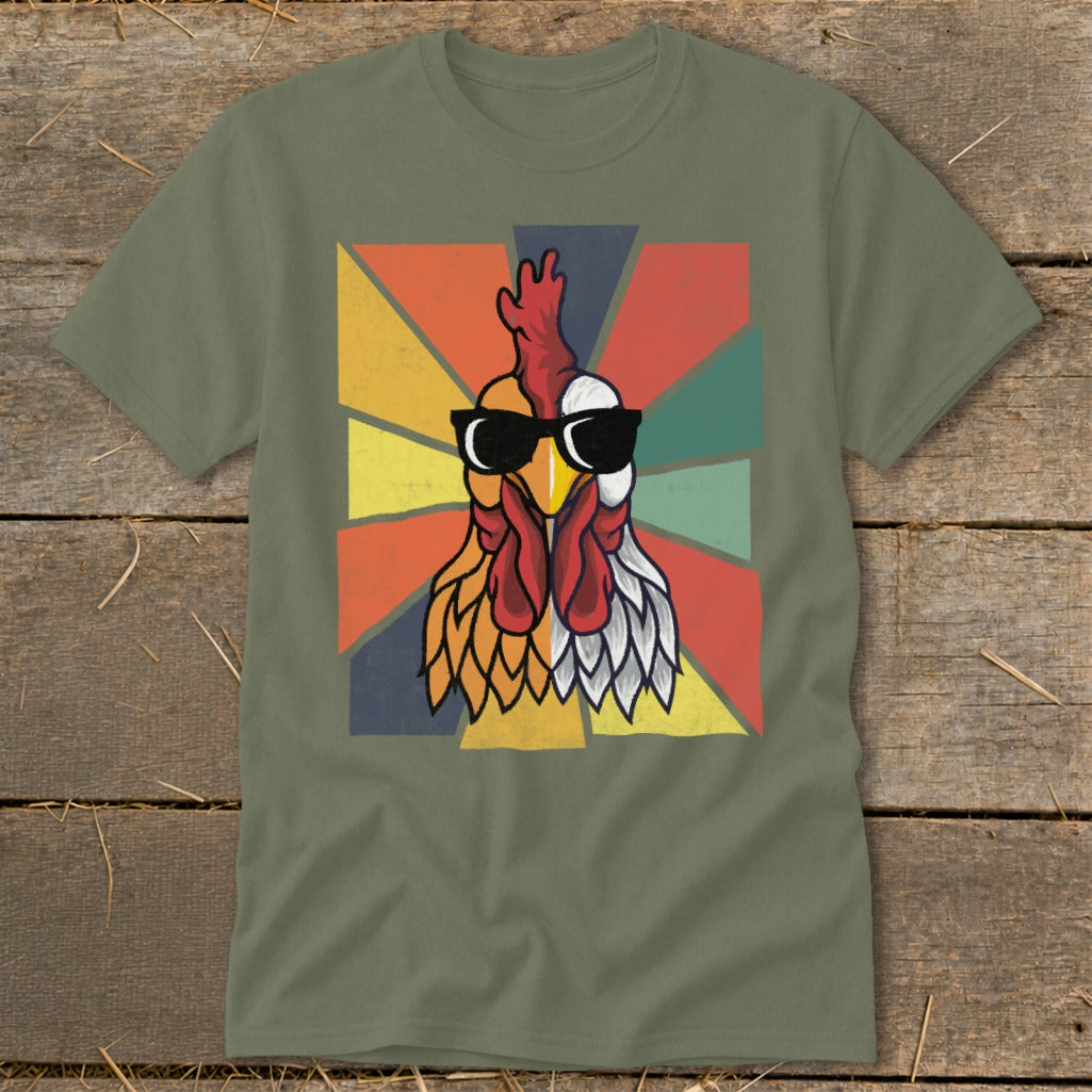 Rooster with sunglasses and retro sunburst graphic on a green t-shirt.
