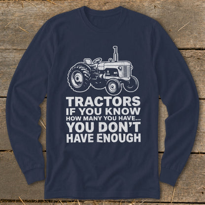Navy long sleeve shirt with tractor graphic and text "Tractors if you know how many you have... you don't have enough".