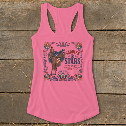 Pink tank top with western saddle and "Saddles & Stars Since 1776" text.