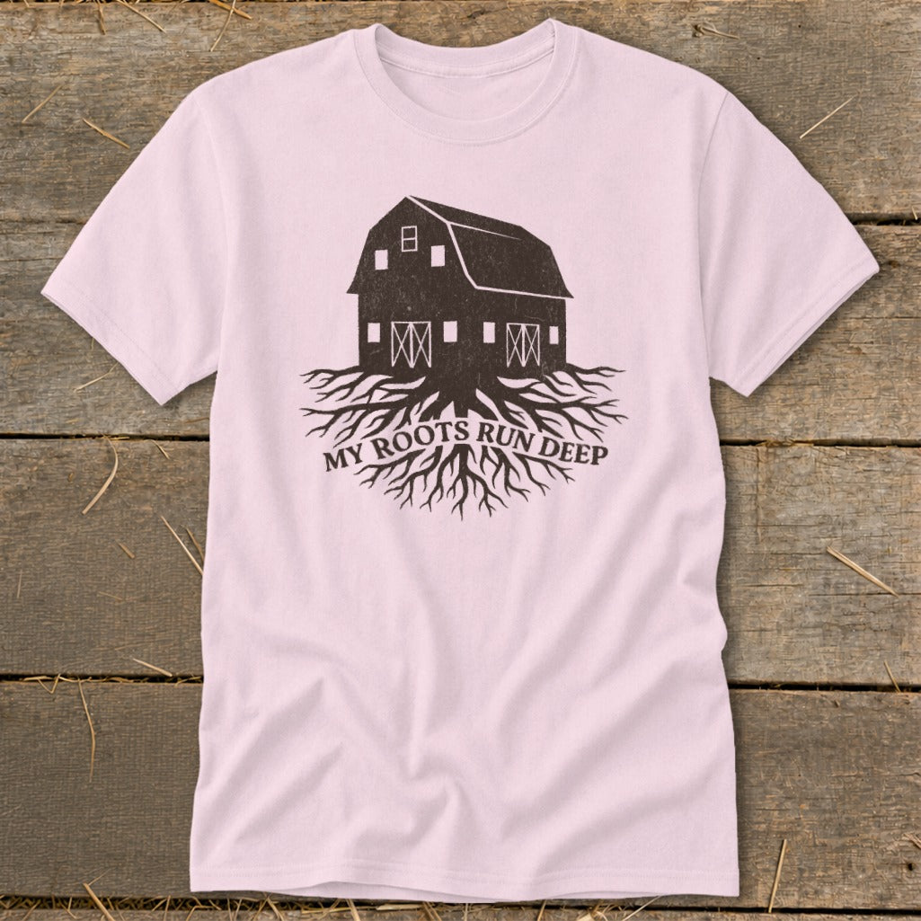 Pink t-shirt with a dark barn graphic on exposed roots and "MY ROOTS RUN DEEP" text.