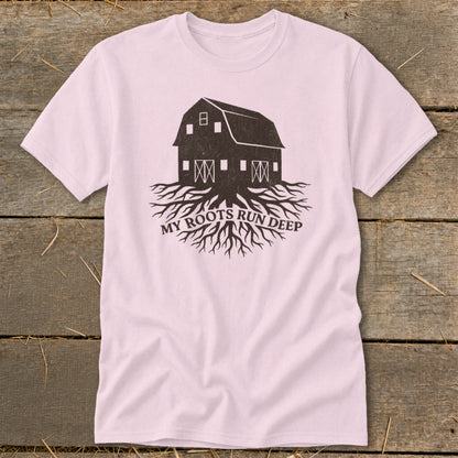 Pink t-shirt with a dark barn graphic on exposed roots and "MY ROOTS RUN DEEP" text.