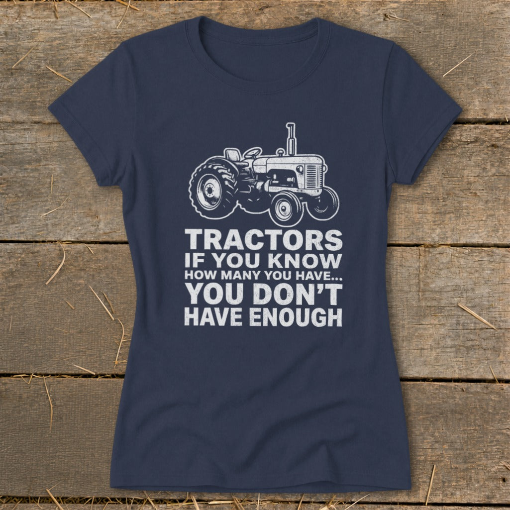 Navy t-shirt with a drawing of a tractor and the text "Tractors if you know how many you have... you don't have enough."