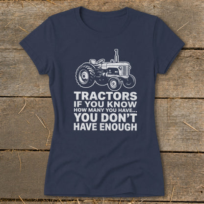 Navy t-shirt with a drawing of a tractor and the text "Tractors if you know how many you have... you don't have enough."