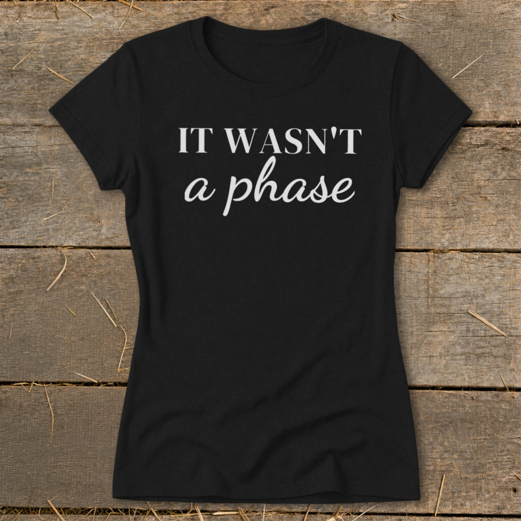 Black t-shirt with white text that reads "IT WASN'T a phase".