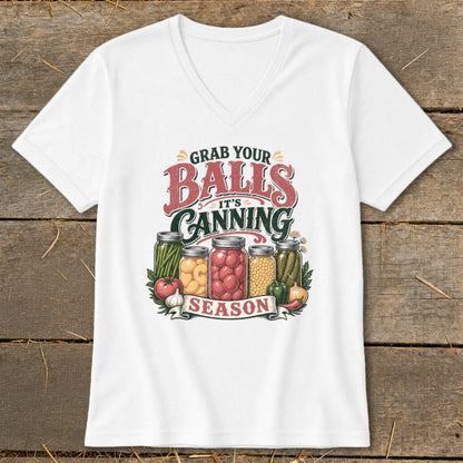 White t-shirt with "Grab Your Balls It's Canning Season" graphic and jars of produce.