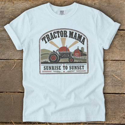 Tractor Mama Sunrise to Sunset graphic on a white t-shirt with farm scene.