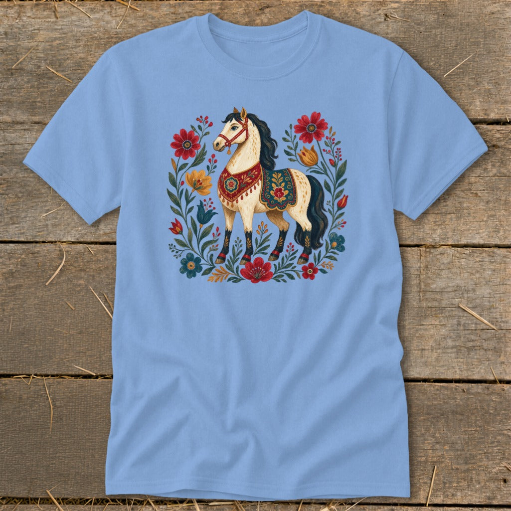 Light blue t-shirt with a cream horse surrounded by colorful flowers and foliage design.