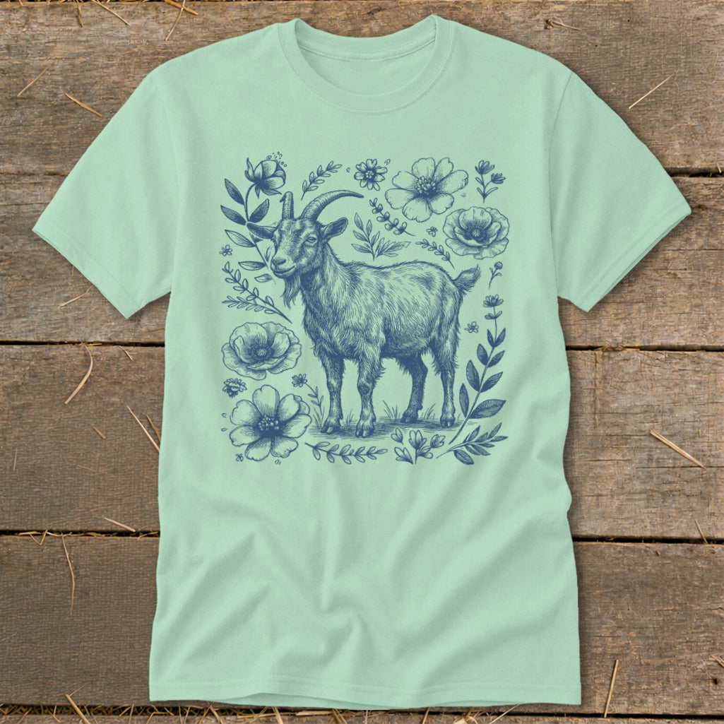Mint t-shirt with blue sketch of a goat surrounded by flowers.