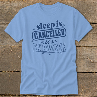 Light blue t-shirt with dark blue text: "sleep is CANCELLED it's FAIR WEEK"