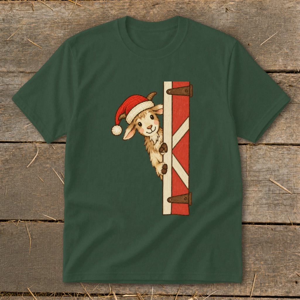 Christmas goat wearing Santa hat peeking around a red barn door.