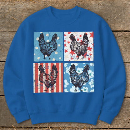 Four decorative chickens with patriotic patterns on a blue sweatshirt.