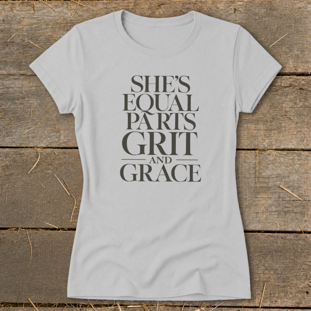 Light grey t-shirt with "She's equal parts grit and grace" text.