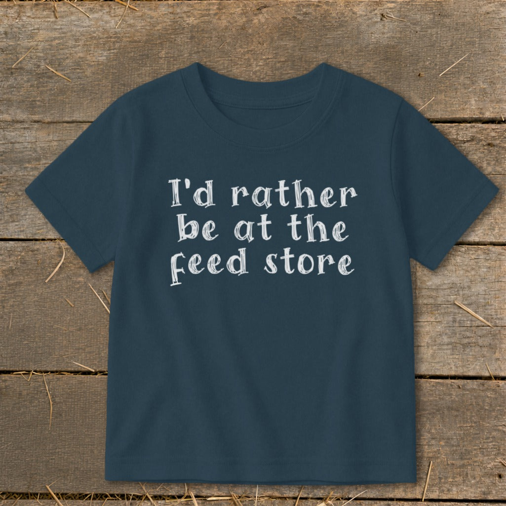 Dark blue t-shirt with white text reading "I'd rather be at the feed store."