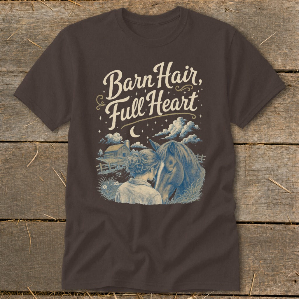 T-shirt graphic with text "Barn Hair, Full Heart" and illustration of a woman and horse.