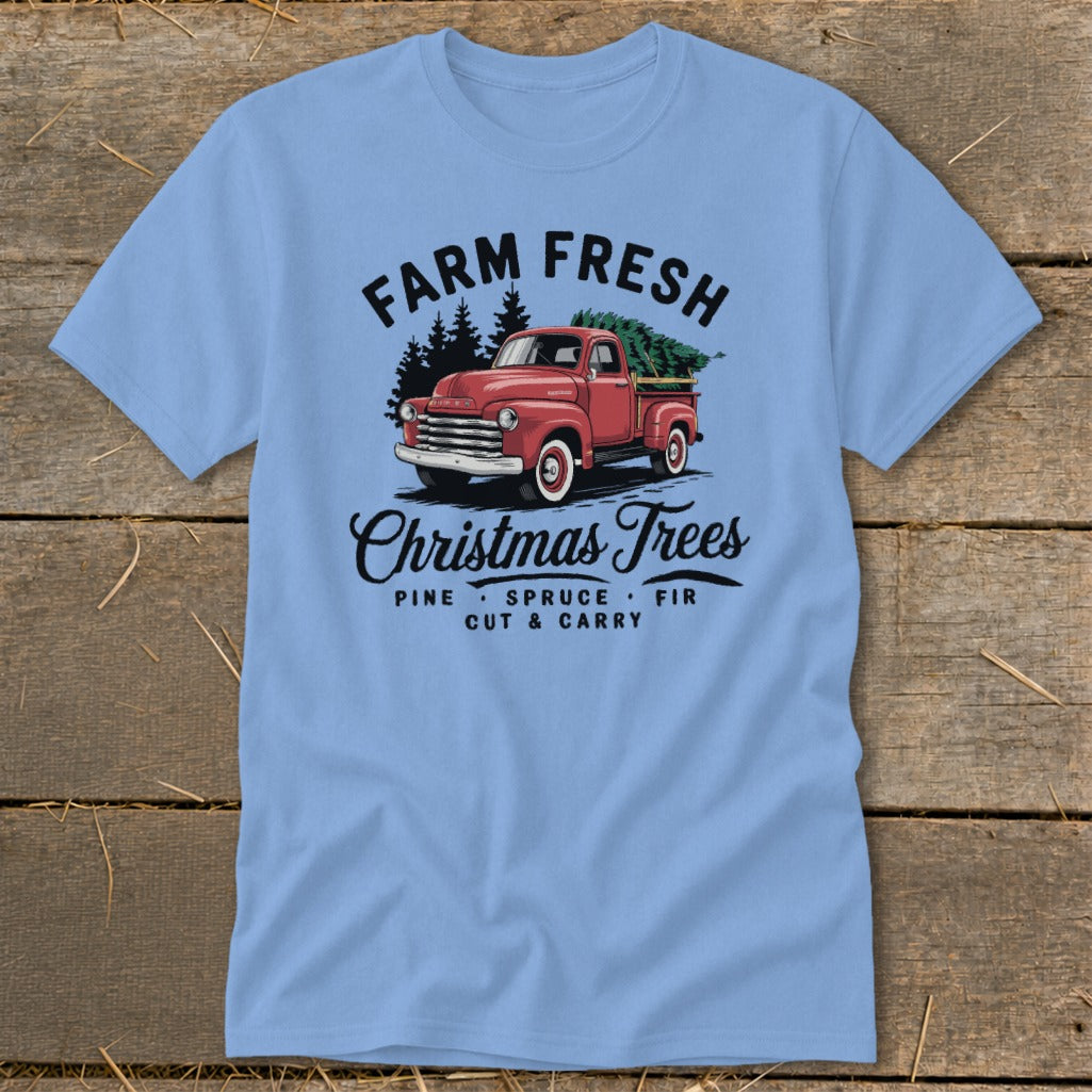 Light blue t-shirt with red vintage truck loaded with Christmas trees and text.