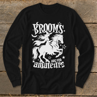Black long-sleeve shirt with white graphic: witch on horse, text "Brooms are for amateurs."