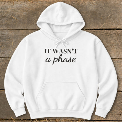 White hoodie with black text reading "IT WASN'T a phase"