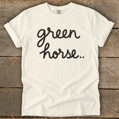 Cream t-shirt with black cursive text reading "green horse.."