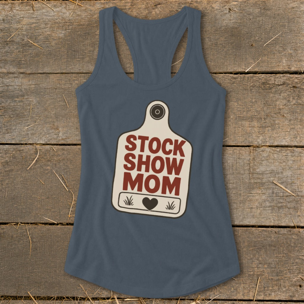 Blue tank top with "Stock Show Mom" text and heart graphic on a tag.