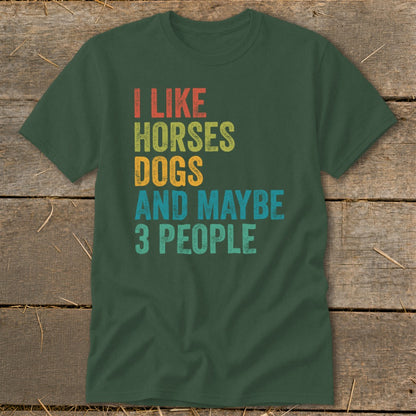 Green t-shirt with "I like horses dogs and maybe 3 people" text.