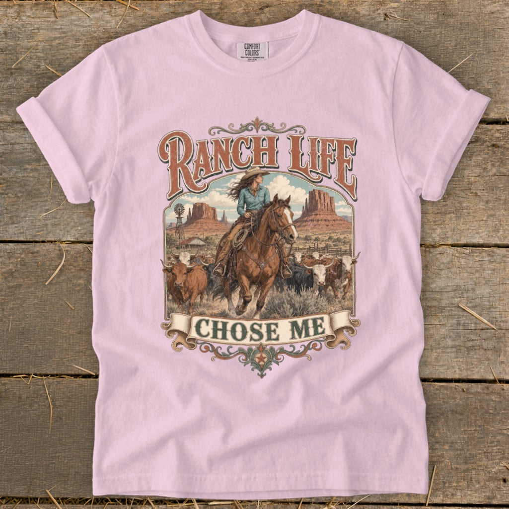 Pink t-shirt with "Ranch Life Chose Me" graphic showing woman on horseback with cattle.