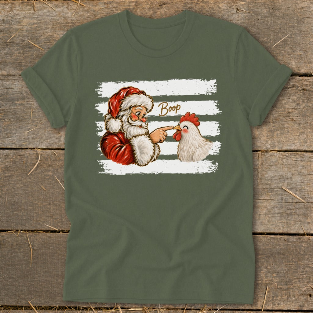 Santa booping a chicken with the word "Boop" above them on a t-shirt.