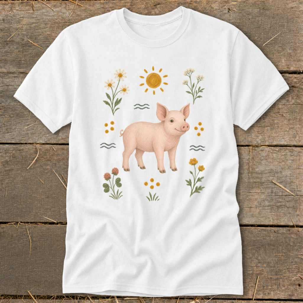 White t-shirt with a pink pig illustration surrounded by flowers and the sun.