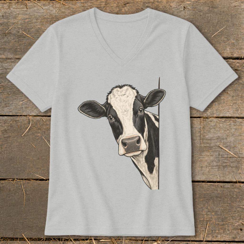 Black and white cow illustration peeking from the side on a light grey v-neck t-shirt.